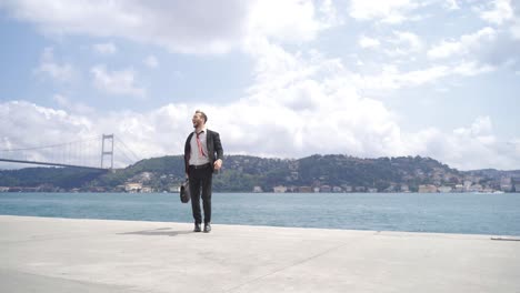 Happy-and-joyful-businessman-against-the-Bosphorus-view.